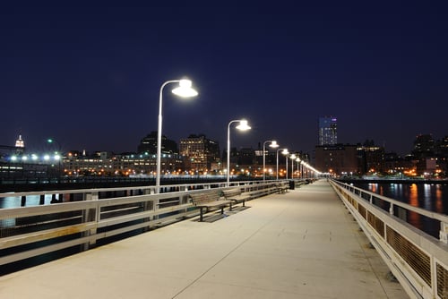 Pier at night with benches and lamps in the city. Pier at night with benches and lamps in the city.